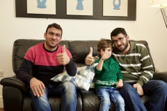 Families - dad, son and uncle give the camera a thumbs up
