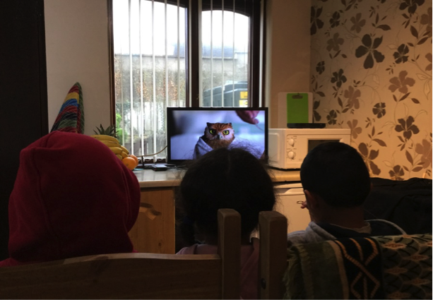 Children watching cartoons on their new TV